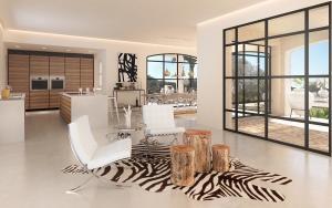 Living room overlooking pool in finca in Santanyi